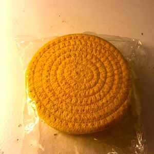 6 Yellow crocheted decorative coasters.